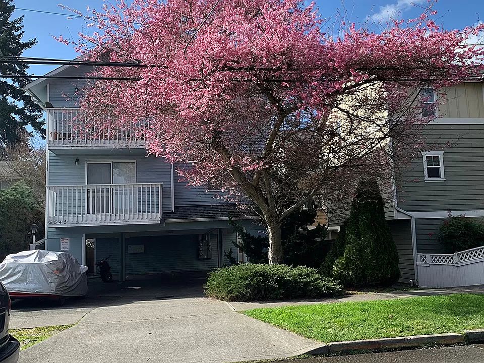 Parking space is on the left (covered car is currently there)