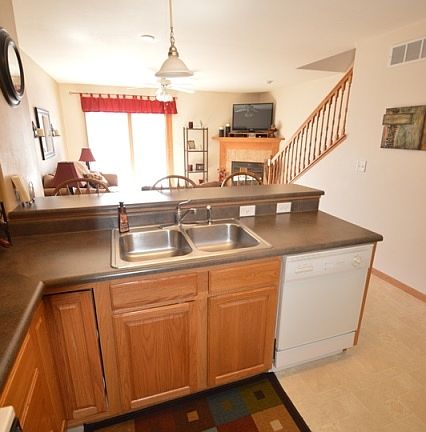 Kitchen leads to living room which has great natural light and lots of living room space.