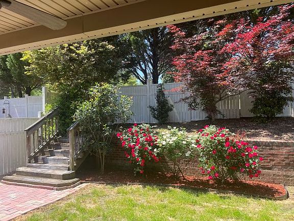 Gorgeous Lanai with flowering shrubs and trees