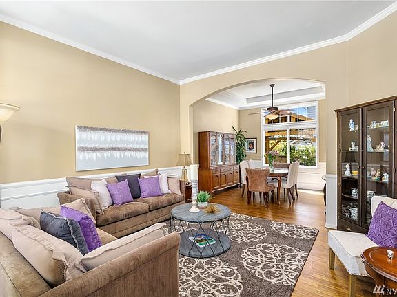 Spacious formal living room opens to formal dining room.