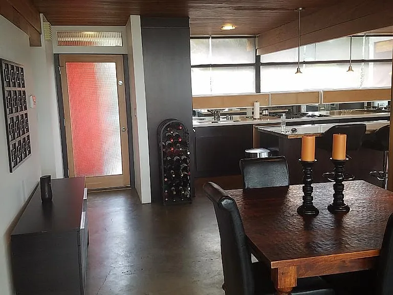 Front entry view showcasing the kitchen and dining area.