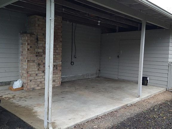 Carport with locking storage unit