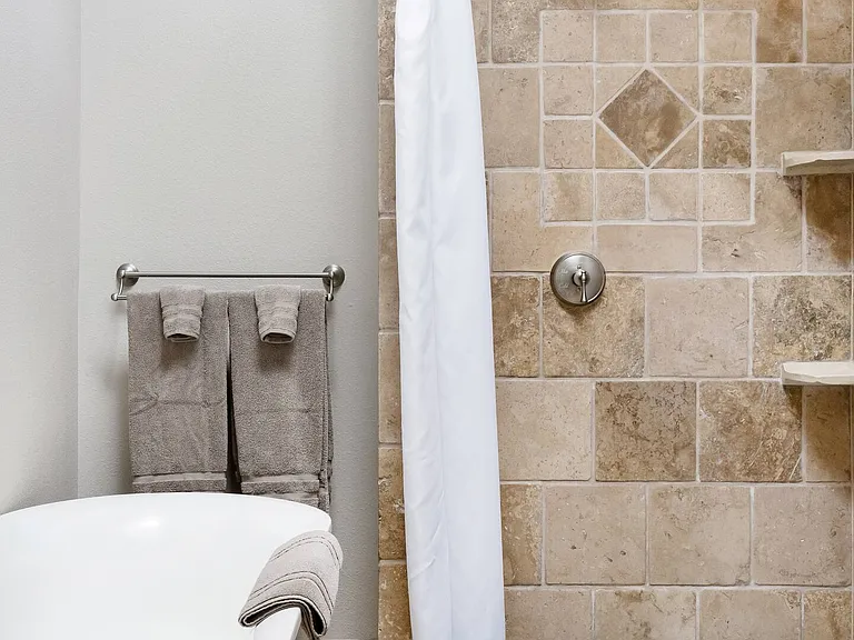 Look up through the skylight while soaking in tub big enough for two.