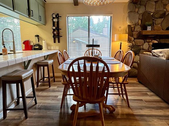 windows off of kitchen and living room view heavenly mountains and the beautiful pines. The area is the back of Lake Village which is quiet and peaceful.