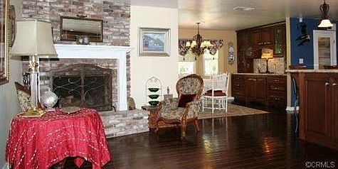 View of Fireplace in Kitchen and Formal Diningroom