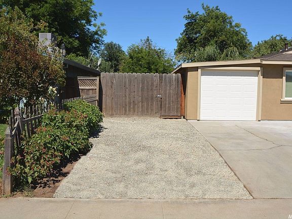 Extra parking or possible boat or RV access on the side of home