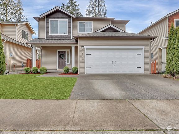 2 car attached garage & plenty of driveway parking.>