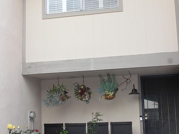 Front of townhome, Upstairs bedroom. 