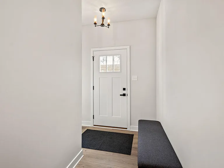 Main entry with coat closet and bench