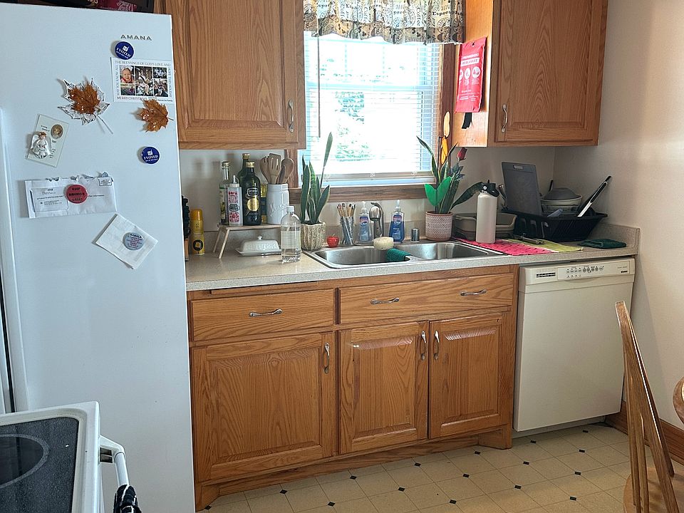 Kitchen includes side by side refrigerator & dishwasher