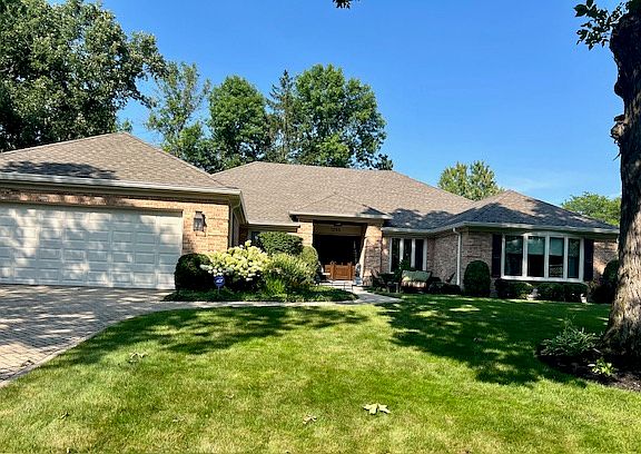Holland Brick paver driveway and walkway. Bay in 3rd brightly sunlite bdrm is visible from street. Landscape is well cared for on a routine basis.