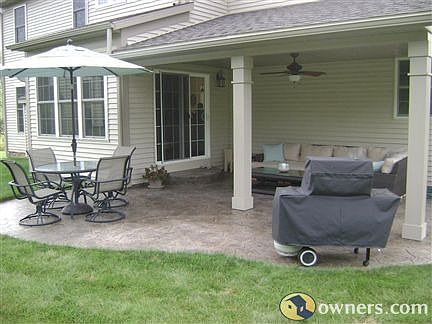 Covered stamped concrete patio with fan