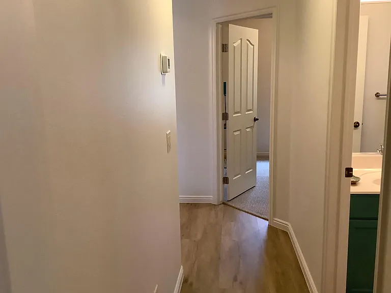 Hall Way to Two Bedrooms and Full Bath