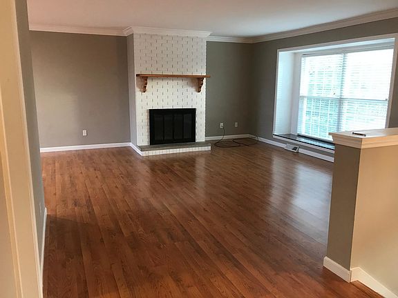 Upper Level Living Room & Wood Burning Fireplace