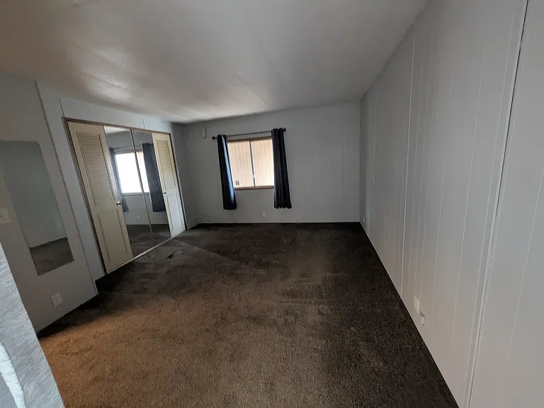 Primary bedroom with closet.