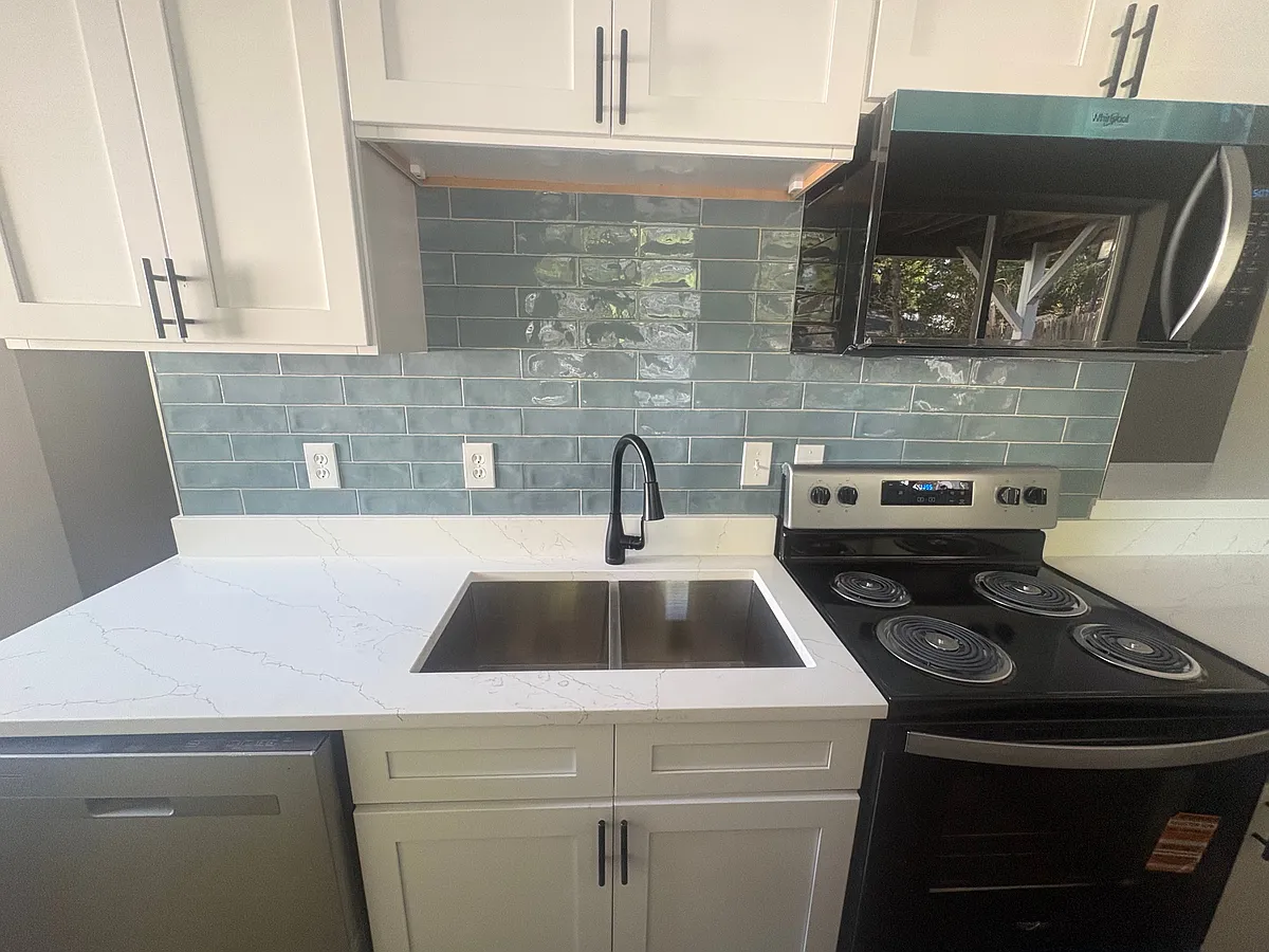 Brand new kitchen with stainless steel appliances, including microwave and dishwasher - 106 Broad St #B