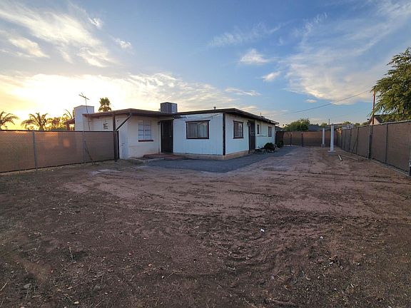 Fenced backyard with privacy screen