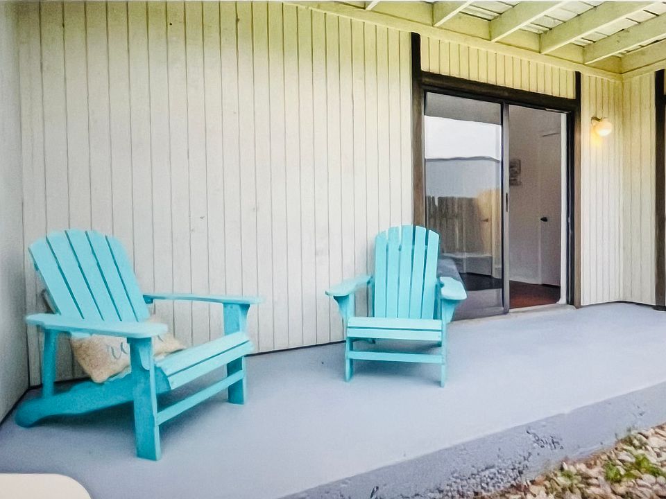 Private covered patio with small outdoor space. _____