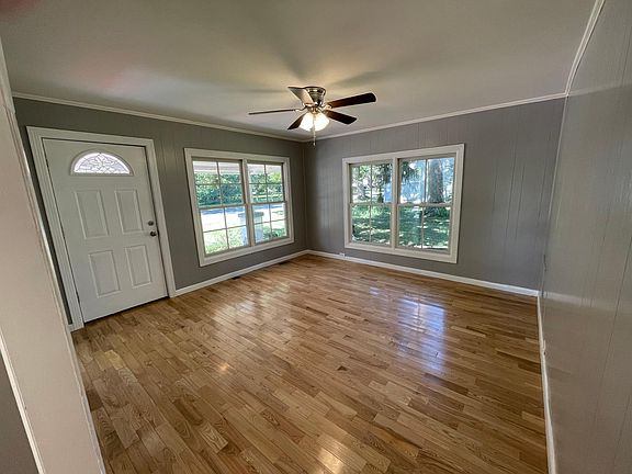 Beautiful living room with tons of natural light and gleaming hardwoods