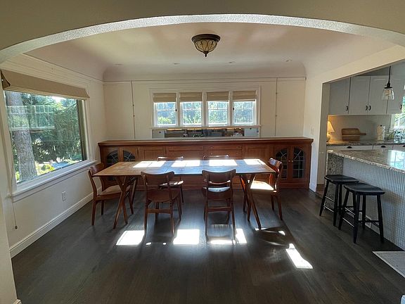 Dining Room w/ original built-ins and gorgeous picture window