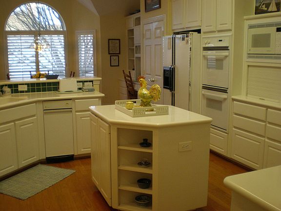 The large kitchen also has double ovens, built-in microwave & trash compactor.