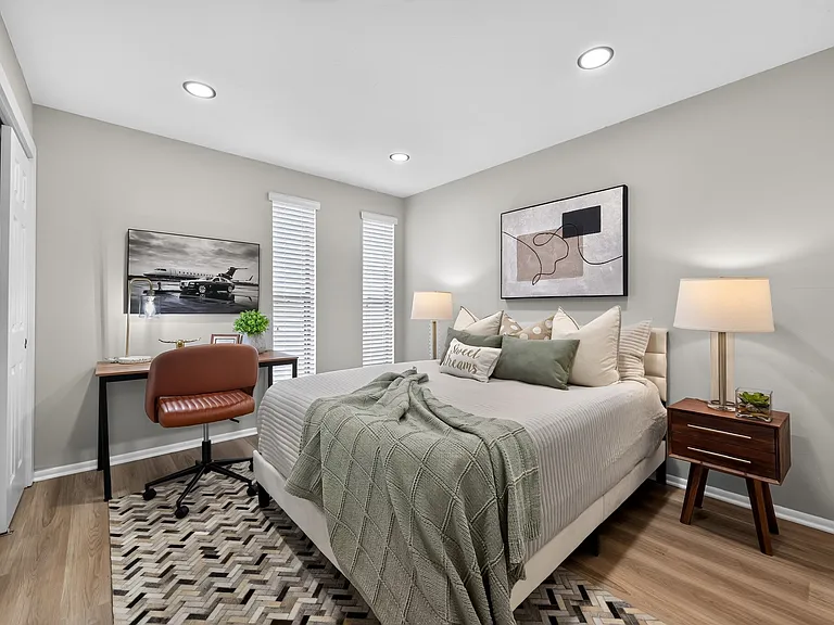Step into a serene retreat at The Woods at Ambler. This beautifully designed bedroom blends comfort with modern elegance, featuring ample natural light and stylish decor. Embrace your ideal living space today! Schedule a tour to learn more.