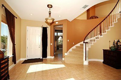 Attractive Entrance With Curved Stairway!