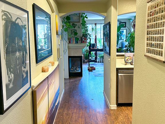 Open air apartment with abundant natural light and a gas fireplace.