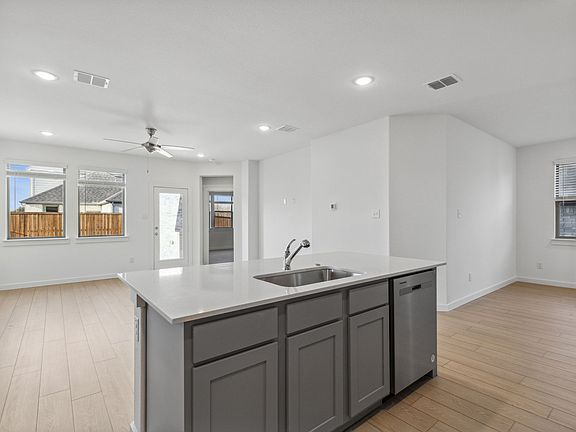 Kitchen in the Oak II home plan by Trophy Signature Homes - REPRESENTATIVE PHOTO