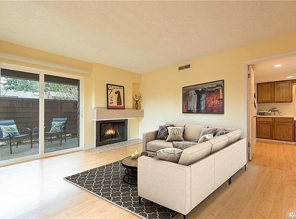 Stretch out in your living room next to the cozy fireplace