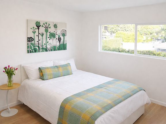 Bright Bedroom With Natural Light And Garden View