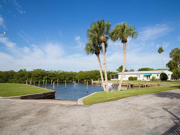 boat ramp with marina. Clubhouse in background