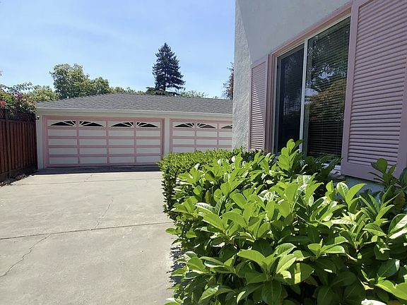 Long driveway to garage and laundry area. BBQ area available for patio dining or small events.