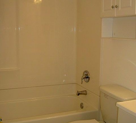 new vanities, tub, and tile floors