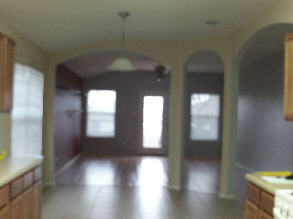 Kitchen looking into living room