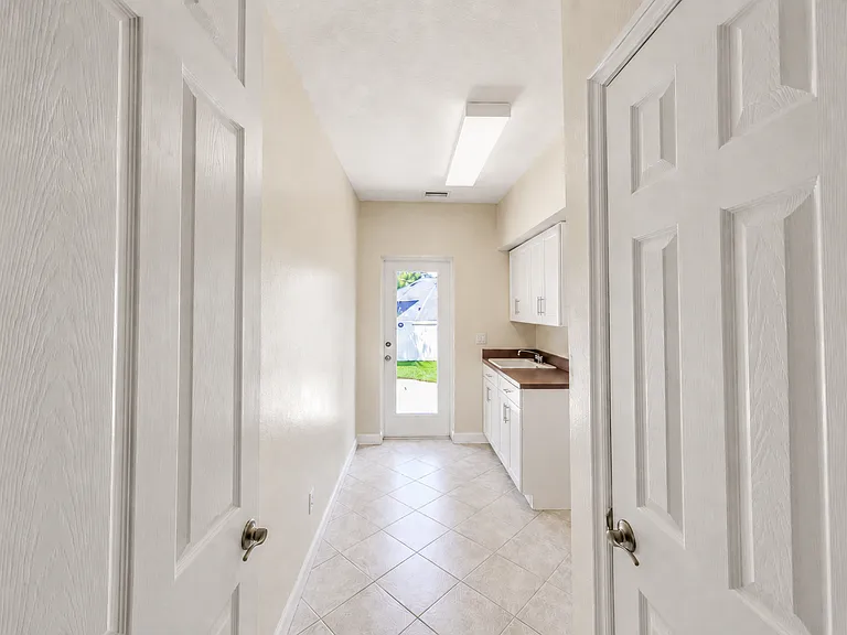 Spacious Laundry Room with Storage and Exterior Access
