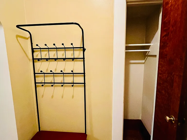 Coat rack and closet inside of the bedroom