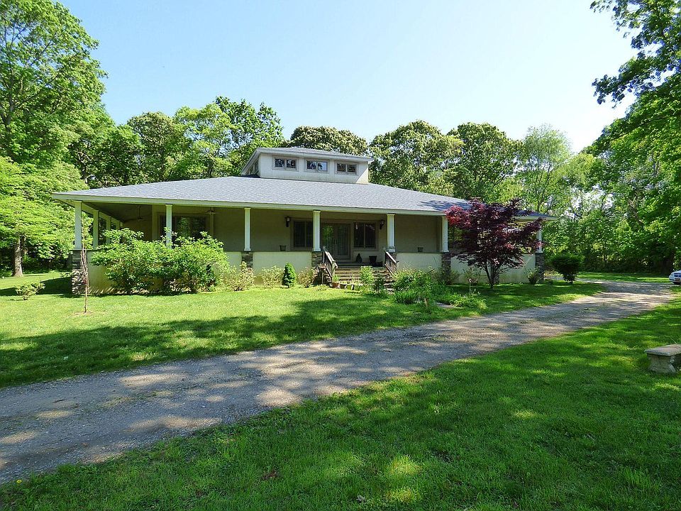 Front of the house with wrap around porch.