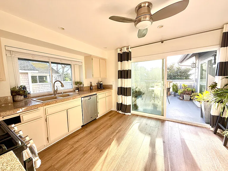 Kitchen leads out to balcony. Watch the sunset while your cooking dinner. Kitchen equipped with full size refrigerator, dishwasher, large floor to ceiling pantry, gas stove/oven & microwave. All stainless steal. Condo also has full size washer & dryer.