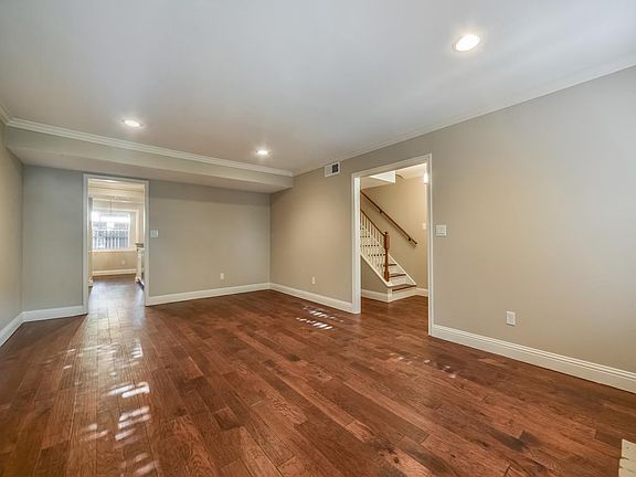 The Very Spacious Living Room is Located off of the Entryway & Kitchen