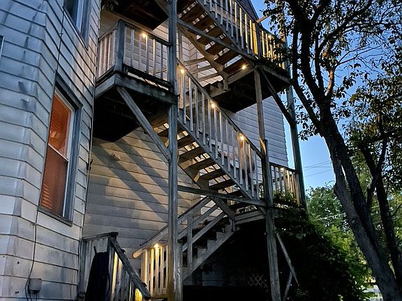 There are stairs on both sides of the building.