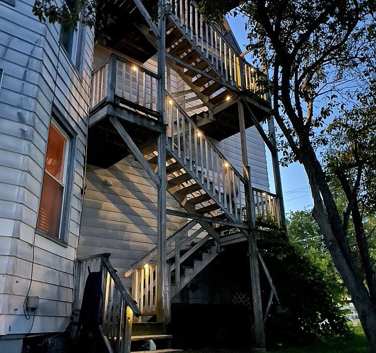There are stairs on both sides of the building.