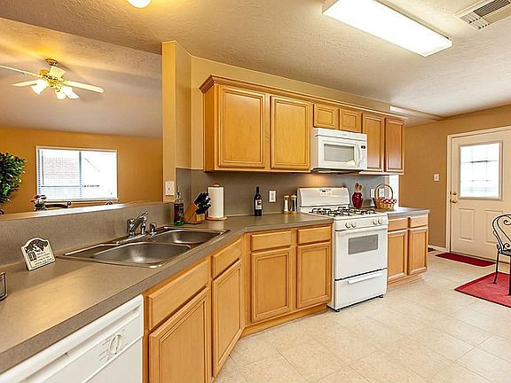 WONDERFUL KITCHEN WITH HIGH BAR TO DEN ~ TILE FLOORING