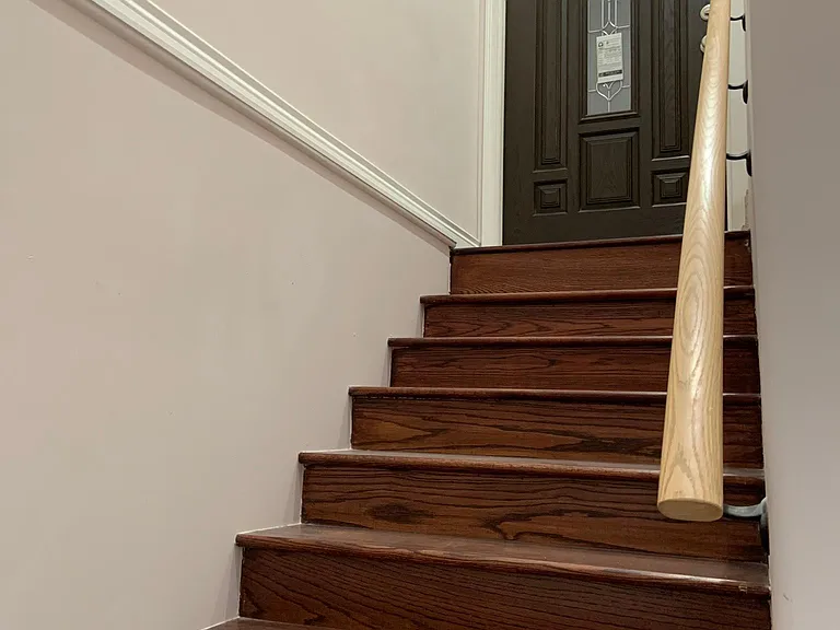 Stairs leading down to Unit G from front door