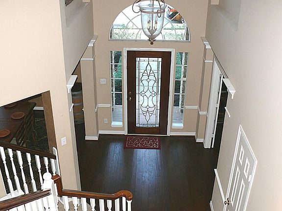 Step into grand entry with scraped wood floors throughout most of downstairs!