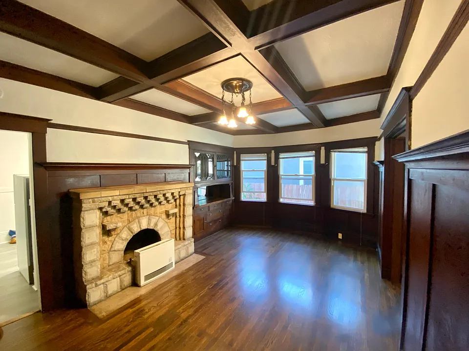 living room with fireplace and built in buffet