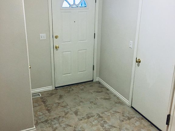 Large entry way has a deep coat closet and access to the 2-car garage