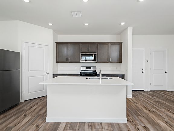 The kitchen has tons of countertop space for cooking all the meals for family and friends!