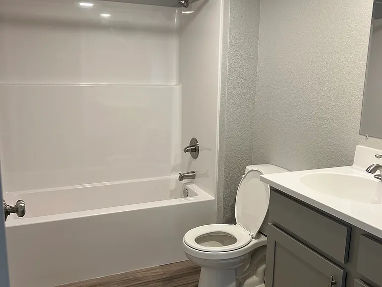 Bathroom with shower/tub combo - toilet - sink and vanity