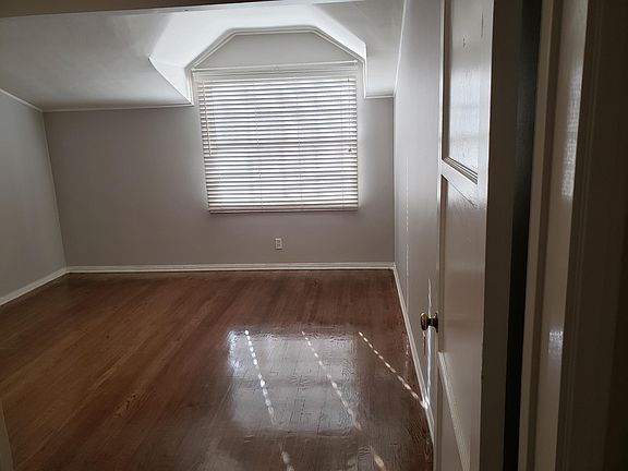 Bedroom with two closets (not shown).